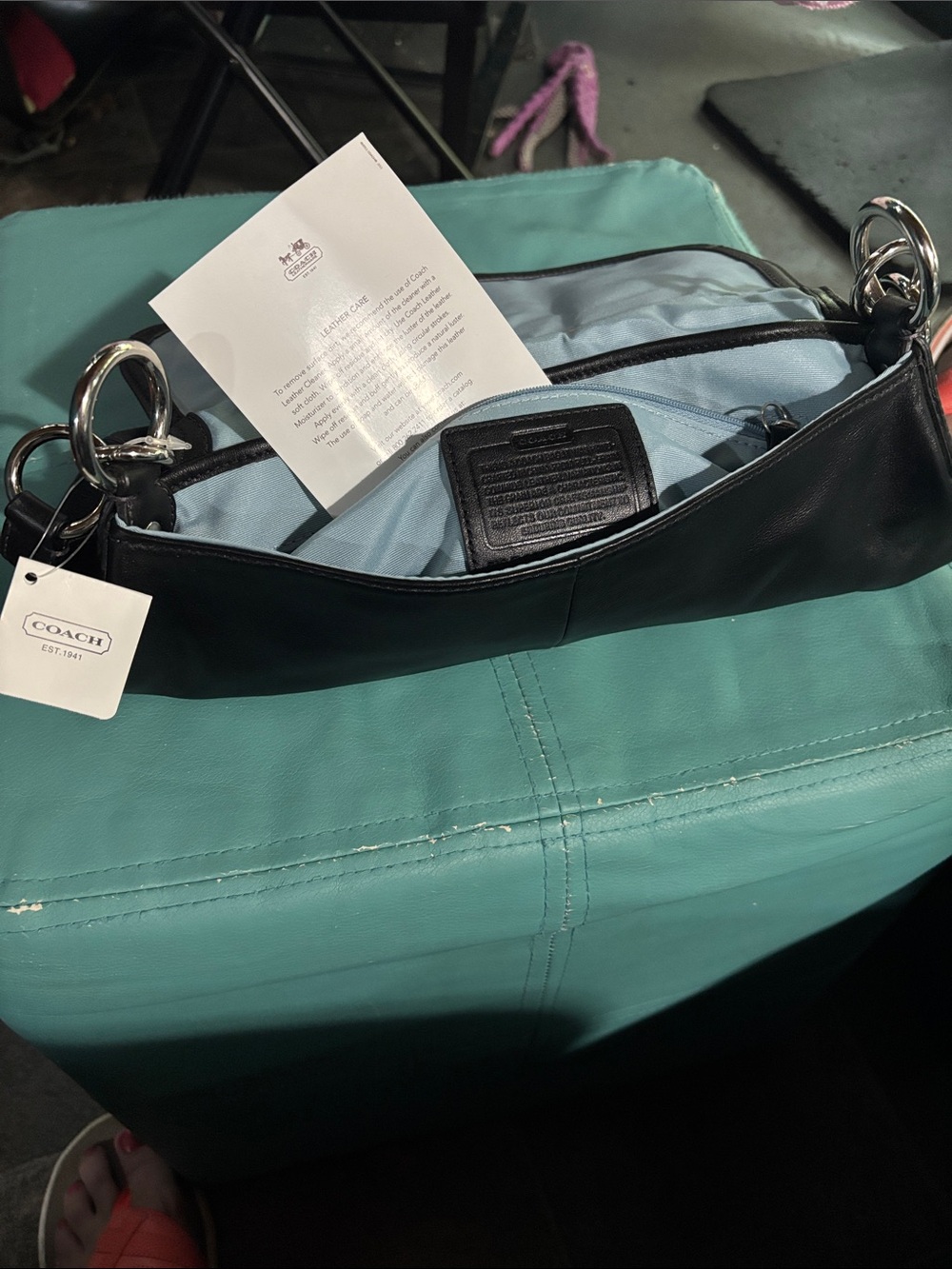 Coach Black Leather Shoulder Bag with Light Blue Interior and Silver Hardware
